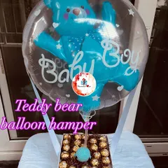 A "Baby Boy" announcement or baby shower gift. This hamper features a box of Ferrero Rocher chocolates topped with a blue teddy bear balloon.