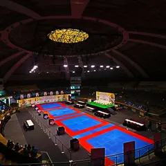 A wide-angle view of the Talkatora Indoor Stadium set up for the 19th All India Independence Cup. The arena is prepared to international standards for our athletes.