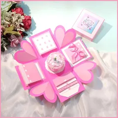 This is my classic heart-themed explosion box, opened up to show all its layers. It has space for messages, photos, and a small gift in the center, all wrapped up in a pretty pink design.
