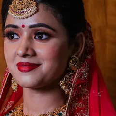 A close-up of the bridal look, showing the beautiful makeup and traditional gold maang tikka that pairs perfectly with my rental lehengas.