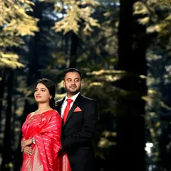 A close-up of the couple from their forest pre-wedding shoot. The focus here is on their connection, with the warm, golden-hour light filtering through the trees to create a dreamy, romantic mood.