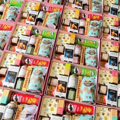 A rainbow of treats! These return favor boxes are packed with a huge variety of goodies, from Lindt and Toblerone chocolates to waffle crisps, protein bars, and instant coffee cubes.