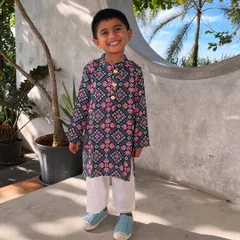 Who says ethnic wear for boys can't be fun? This Patola print kurta is one of my favorites. It’s crafted from breathable cotton, so your little man can run, jump, and play comfortably while looking incredibly dapper.