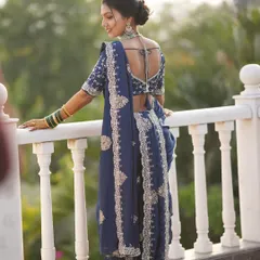 The final result is pure grace. This is a custom Vidhi look, where the drape is just as important as the makeup and hair to complete the bride's vision. Notice how the pallu is arranged to beautifully showcase the blouse and jewelry.