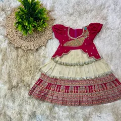 The same frock, now with a beautiful peacock motif embroidered on the bodice, adding a special touch for the little one.
