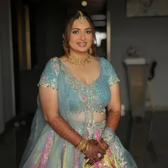 A happy bride-to-be at her Haldi ceremony. Dhruvi's makeup is kept light and radiant, allowing her natural glow to shine through.