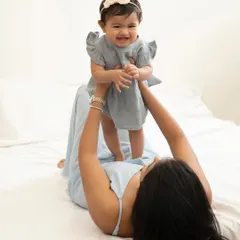 The pure joy of being lifted in the air by mom. These playful interactions result in the most genuine smiles and are a beautiful part of any sitter session.