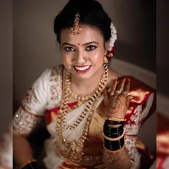 A bright and happy bridal portrait. Lavanya's smile lights up the frame, capturing the joy of her wedding day.
