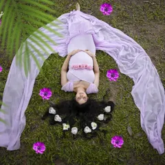 This creative top-down shot from a maternity session shows how hair and styling can be used to frame a photo. I arranged her long hair with flowers to create a beautiful, artistic effect.
