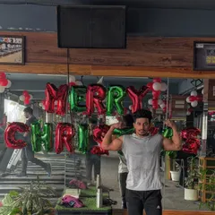 A member posing with our Christmas decorations. The gym is more than just a place to work out, it's a place to feel good and share positive energy.