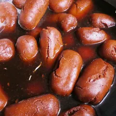 Freshly made Gulab Jamuns soaking in sugar syrup. This classic Indian sweet is a must-have at any celebration and is a specialty of mine.