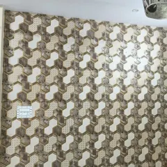A complex geometric wallpaper with interlocking hexagonal shapes and varied textures.