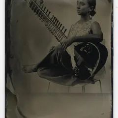 A timeless portrait of a musician with her sitar, created using the historic wet plate collodion process. This 19th-century technique gives each image a unique, soulful quality that digital photography cannot replicate.