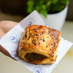 This is how you tackle a Mumbai monsoon. Our classic Chicken Puff, with its flaky pastry and savory filling, is the ultimate comfort food.