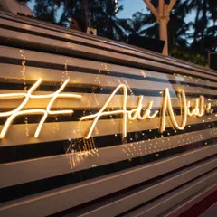 A custom neon sign featuring the couple's wedding hashtag. This modern detail served as a cool, personalized backdrop for the Sangeet stage and a great photo spot for guests.