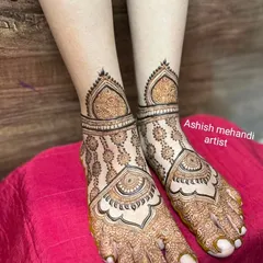 A delicate and beautiful foot design with a central mandala and intricate patterns extending to the ankles.