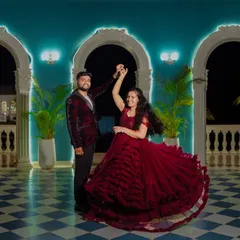 Dancing the night away. This deep red ruffled ball gown has incredible movement, creating a beautiful, full circle as the couple dances during their evening photoshoot.