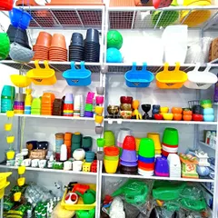 My shop is stocked with a huge variety of colorful plastic and ceramic pots. I have options for every style and need, from simple nursery pots to decorative planters.