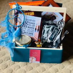 I love making gifts personal. This 18th birthday hamper for Adithyan includes a custom keychain with his name, a milestone card, and a dreamcatcher, all curated around a cool blue theme to perfectly match his style.