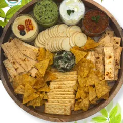 Another view of my popular Chip 'n' Dip platter, featuring a variety of crunchy snacks and four different homemade dips. It's a gourmet take on a classic party snack.