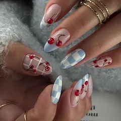 Another take on the cherry nail trend, this time with a fun blue and white checkerboard pattern. I can customize these designs with any color combo.