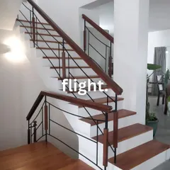 A beautiful flight of stairs is a major architectural feature. We designed this one with a classic combination of wood treads and railings with simple black metal balusters.