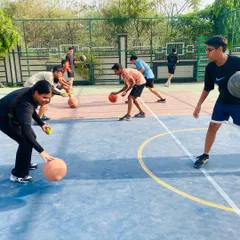 A group of players works on synchronized dribbling drills to improve rhythm and handling.