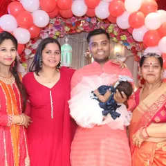 A lovely family portrait with the newborn baby at the center of all the love and attention. Perfect for framing and remembering this special day.