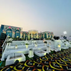Another perspective of the grand stage setup, showing how the patterned carpet extends across the entire venue floor. This ensures a cohesive and immersive decorative theme for the whole event space.