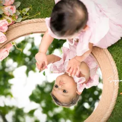 Another angle of the mirror shot, showing the baby's curiosity and the beautiful reflection of the sky and trees.