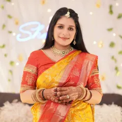 A classic portrait of the mother-to-be at her baby shower. Her traditional attire and the beautifully decorated background come together to create a cherished memory of the event.