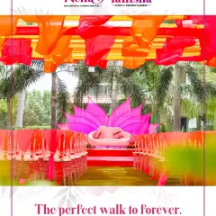 This is more than an aisle; it’s the perfect walk to forever. For this colorful event, we created a stunning path with bright overhead draping and a lotus-themed stage, designing the entire journey with emotional impact.