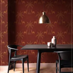 The Sundarban Boota wallpaper in a deep red, featuring a repeating pattern of deer and palm trees. This design brings a warm, earthy, and narrative quality to this modern dining space.