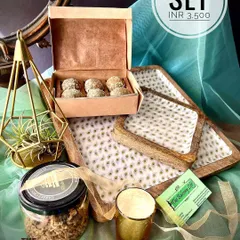 Why have one platter when you can have a set? This hamper is perfect for those who love to host. It includes a beautiful set of three nesting square platters, a jar of spent grain granola, a box of our signature sweets, and a soy wax candle to set the mood.