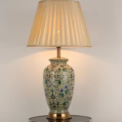 This ceramic table lamp is perfect for adding a touch of traditional charm to any room. The neutral, floral-patterned base is versatile enough to complement a wide variety of home decor styles, from classic to eclectic.