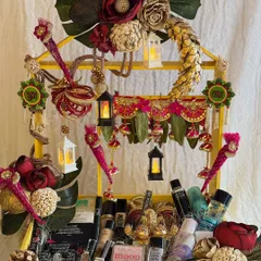 A festive hamper designed to feel like a personal treasure. This arrangement includes a beautiful bandhanwar, mini lanterns, and a curated selection of cosmetics, making it a thoughtful 'pehli Diwali' gift.