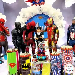 Assembling the ultimate superhero party! This event featured live character mascots including Spider-Man, Deadpool, and Iron Man, posing with the birthday boy for an unforgettable experience. The decor included themed cupcake stands and a full superhero backdrop.