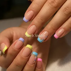 This is a fun, modern version of the French manicure. Each nail has a different pastel tip in shades of lilac, yellow, blue, and pink, perfect for adding a pop of color to your look.