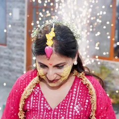 A beautiful portrait of the bride during her haldi, with sparklers adding a magical touch in the background. I can work in any lighting to create stunning event photos.