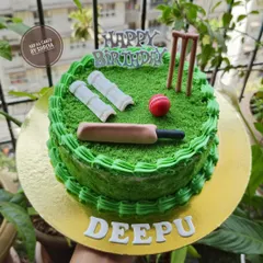 A cake that's a perfect match for someone who lives and breathes cricket. The green buttercream grass, fondant pitch, and edible bat, ball, and wickets make this a sixer of a birthday cake.