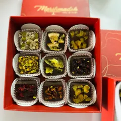 A closer look inside my Diwali gift box, featuring an assortment of my exotic fruit-infused chocolates. Each one is a guilt-free bite of pure chocolate and fruit.