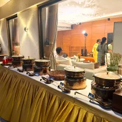 Another angle of this stunning in-home buffet. You can see how the setup integrates seamlessly with the client's decor, providing a high-end catering feel for an intimate gathering.
