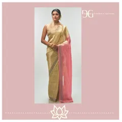 A full view of the pale yellow and rose tissue jacquard saree. Paired with a high-neck, sleeveless blouse, it showcases a modern interpretation of classic bridal elegance.