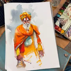The completed watercolor portrait of a sadhu from my Bangalore workshop. The vibrant oranges and yellows of his attire contrast with the cool, muted background, drawing focus to his calm and dignified presence.