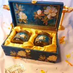 This hand-painted wooden box with matching jars is a perfect example of our luxury Diwali collection. It combines traditional artistry with practical use, creating a gift that will be cherished.