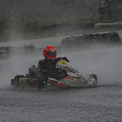 Racing in the rain is the ultimate test of skill and bravery. Here, one of our drivers navigates a soaking wet track during the National Championship, kicking up a massive spray.