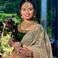 A beautiful collaboration with a local makeup artist, showcasing a stunning look for a Mehendi or Haldi ceremony. The model is wearing a mustard lehenga with a green velvet blouse, perfect for festive celebrations.