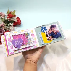 Inside the scrapbook from the 'Shirt Box' hamper. This page has a fun shaker heart and a photo of the happy couple, making it a truly personal part of the gift.