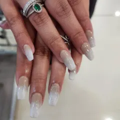 A flawless example of a classic favorite: nude and white glitter ombre nails. This elegant design on long square extensions shows a seamless blend of color and sparkle, perfect for any occasion.