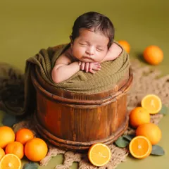 The final result of the citrus-themed bucket pose, showing how props and color can create a fresh and unique portrait.